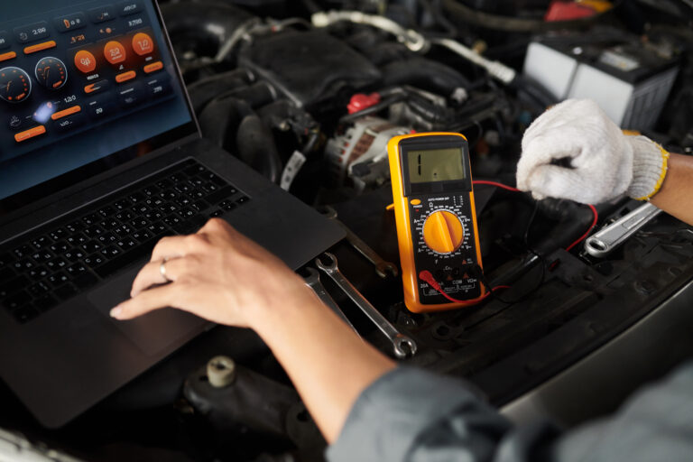 Mechanic Using Multimeter